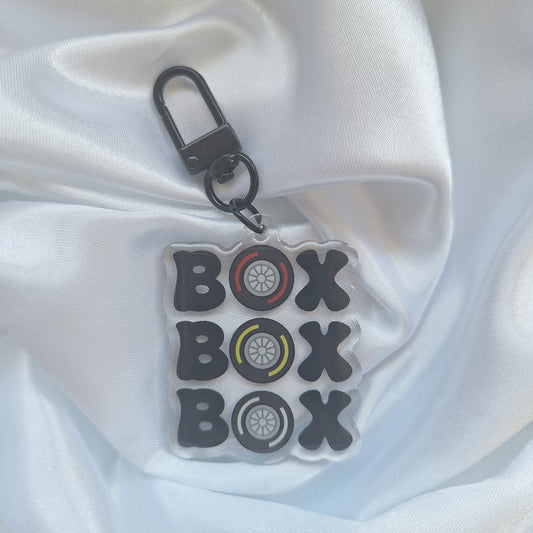 Clear acrylic keychain with 'box box box' design