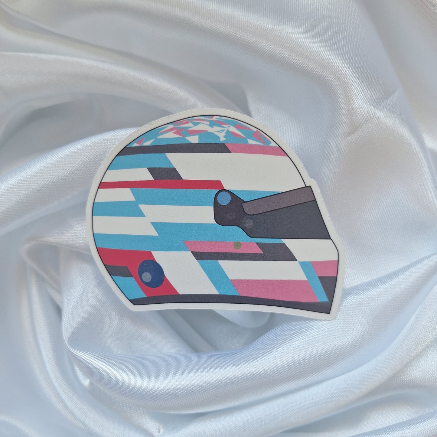 Franco Colapinto 2026 Formula 1 helmet sticker featuring a blue, white and pink geometric racing helmet design with a dark visor on a white background.