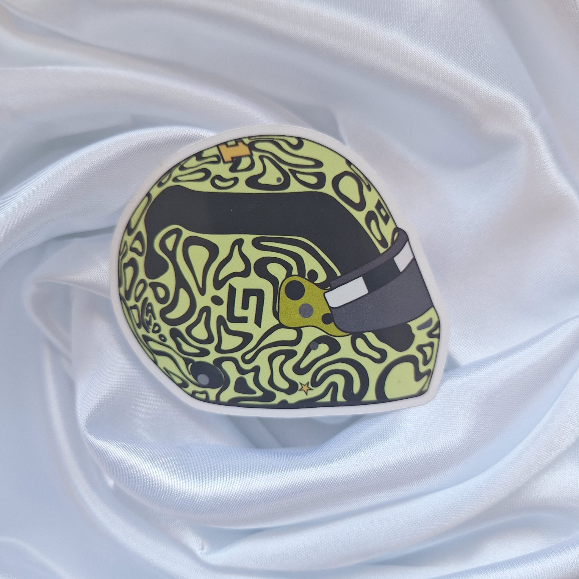 Lando Norris 2026 Formula 1 helmet sticker featuring a fluorescent yellow helmet design with abstract black pattern details and tinted visor.