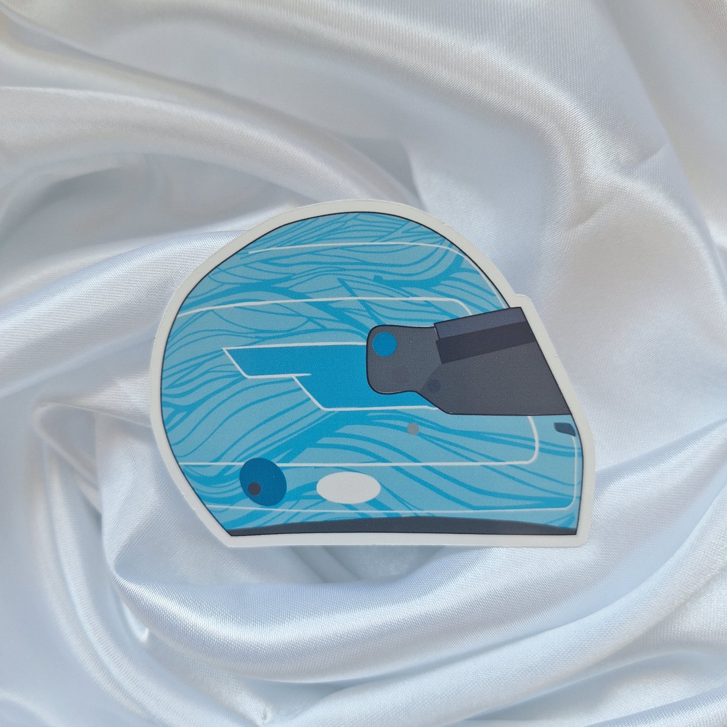 Pierre Gasly 2026 Formula 1 helmet sticker featuring a light blue racing helmet design with wave-inspired graphics and a dark visor on a white background.
