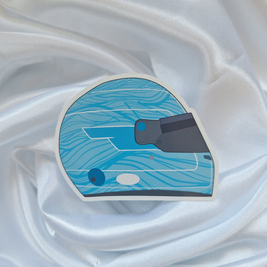 Pierre Gasly 2026 Formula 1 helmet sticker featuring a light blue racing helmet design with wave-inspired graphics and a dark visor on a white background.